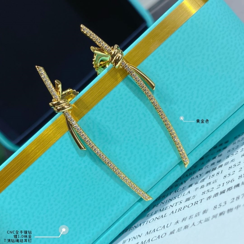 T*f*ny earrings